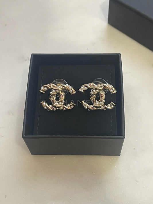 Boucles d'oreilles Chanel CC torsades