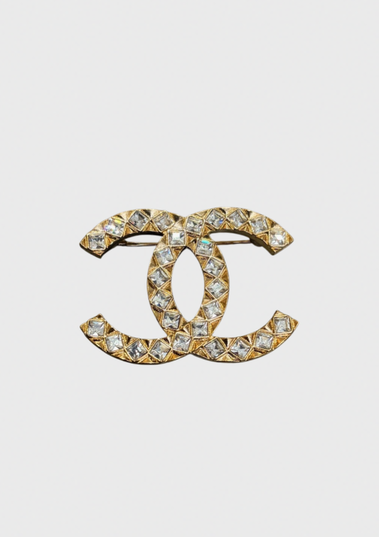 Broche Chanel CC dorée