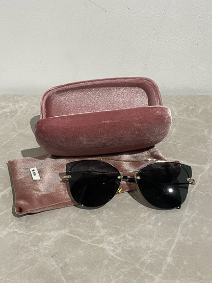 Lunettes Miu Miu dorées