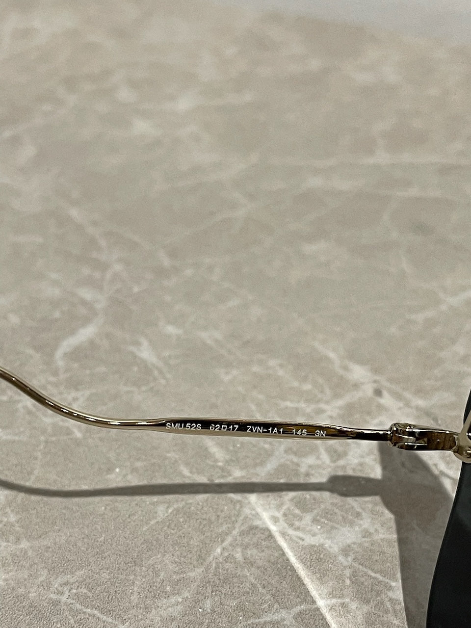 Lunettes Miu Miu dorées