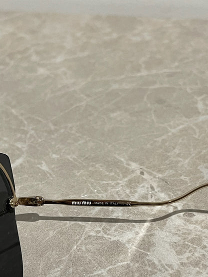 Lunettes Miu Miu dorées