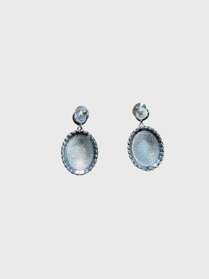 Boucles d'oreilles Chanel medaillon