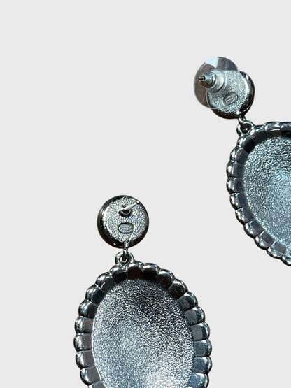 Boucles d'oreilles Chanel medaillon