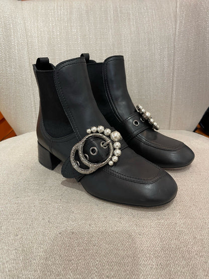 Boots Miu Miu noires T.37